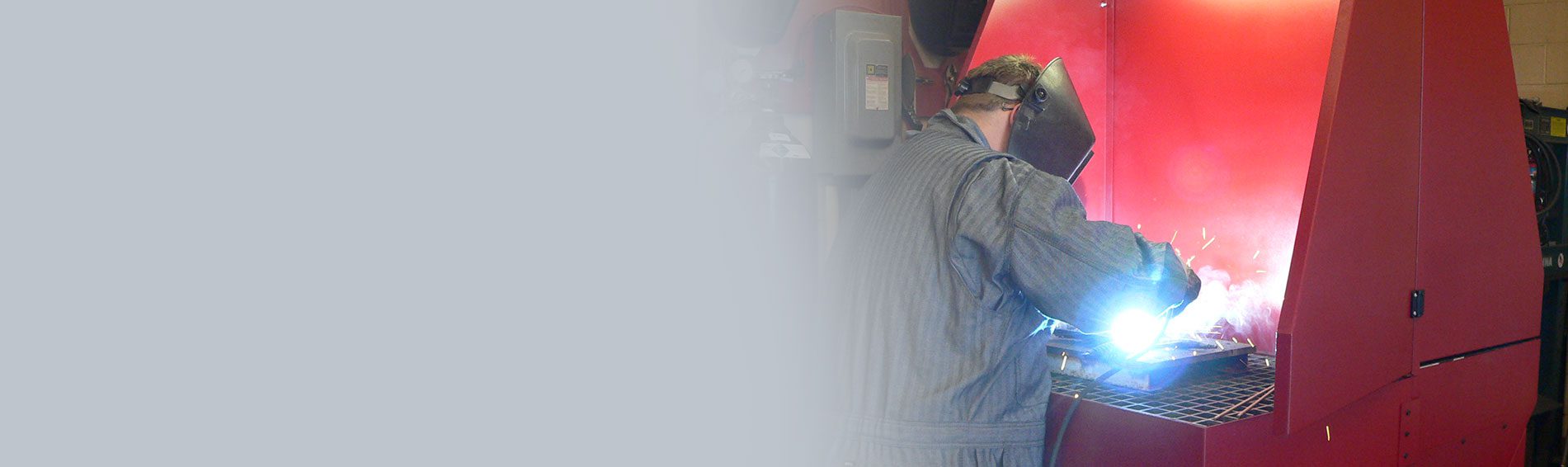 worker using down draft table