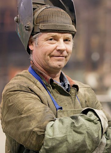 Portrait factory senior welder worker on manufacture workshop